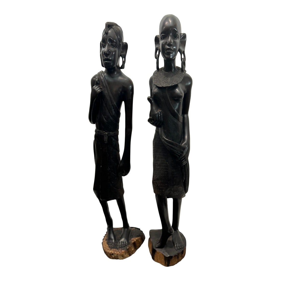 1950s Maasai Figures From Tanzania, African Blackwood (Pair): This is a matched pair of tall carved Maasai figures from Tanzania, executed in solid African Blackwood (Mpingo), one of the densest, heaviest, and most valuable carving woods in the world. The male