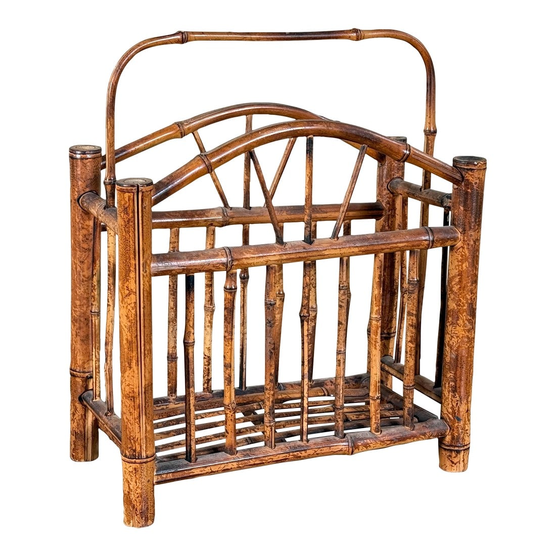 Burnt Bamboo Magazine Rack Chinoiserie Hollywood Regency Rattan Style Holder: Vintage burnt bamboo magazine rack with an arched carry handle, vertical spindle sides, and open slatted base, showing rich flame-darkened bamboo with natural variation throughout; a clean,