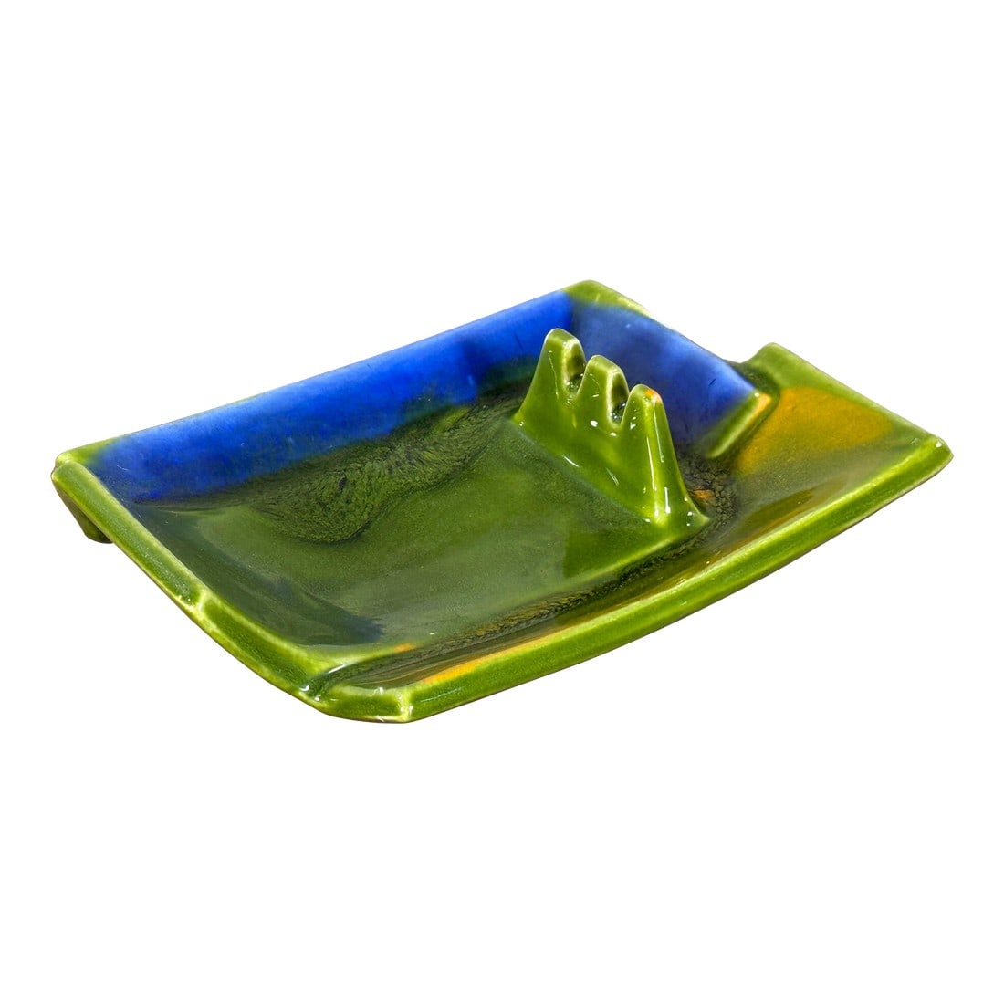 Mid Century Modern Calif Usa Green and Blue Ceramic Ashtray California Art Pottery: Mid century modern California art pottery ashtray marked "Calif USA," featuring a rectangular form with integrated cigarette rests and a glossy green glaze with blue pooling accents, typical of West