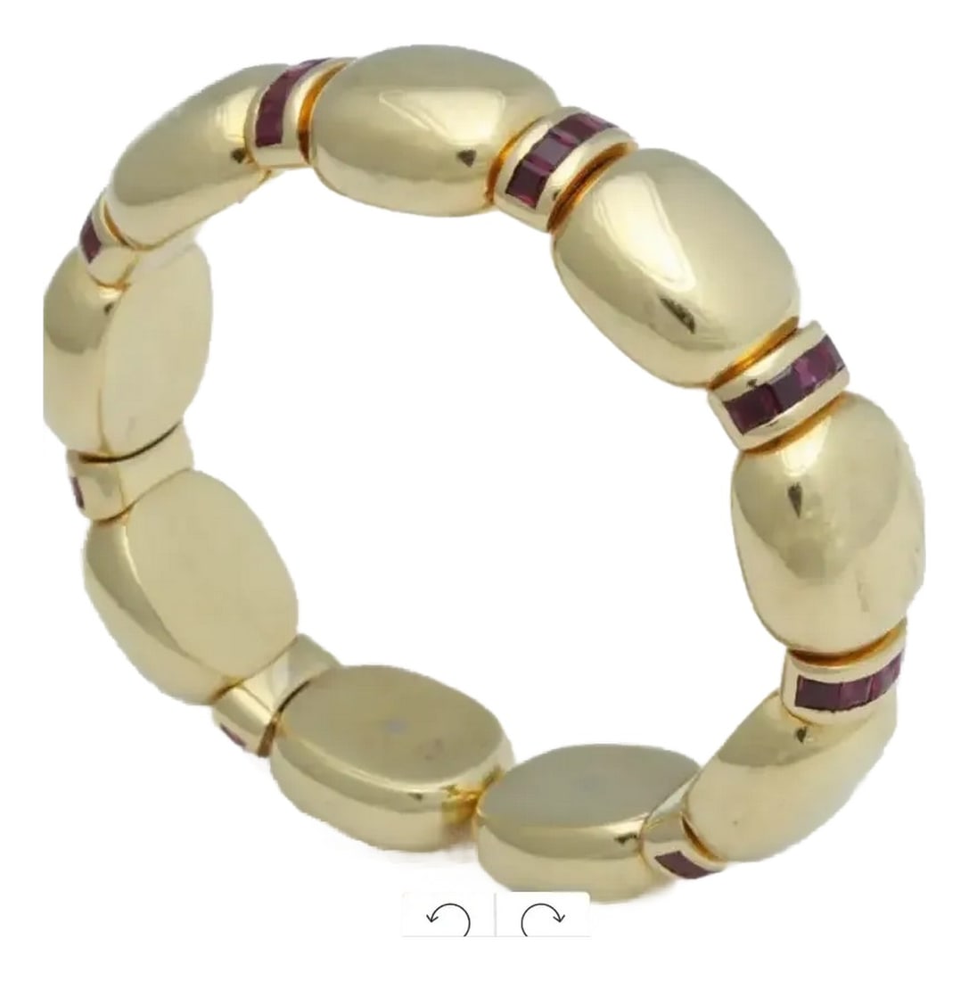 Faraone 18kt Gold Expandable Cuff Italian: Signed Faraone 18kt Expandable Cuff made up of 9 segmented oval sections, each separated by curved bars set with 5 French-cut channel-set rubies. Italian ca 1960 Very elegant Weight 50.6 Dwts =