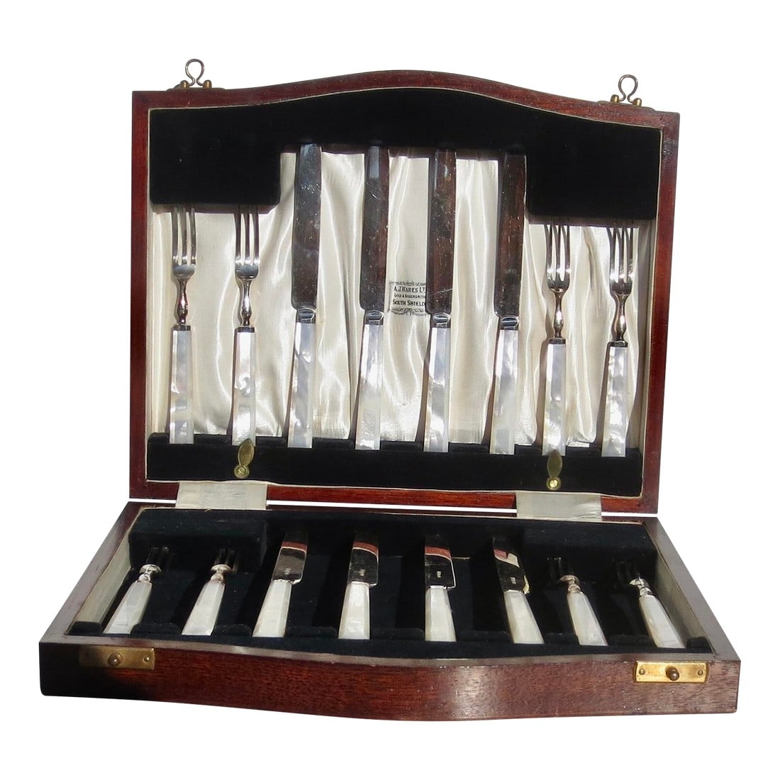 Vintage Mother of Pearl Boxed Serving Set: The set is 16 pieces in a wooden case. The box measures 11.25" by 9". The knife is 7.25" long, and the fork is 5.75" long. Handles are mother-of-pearl with beveled angles. Very clean silver plated. Co