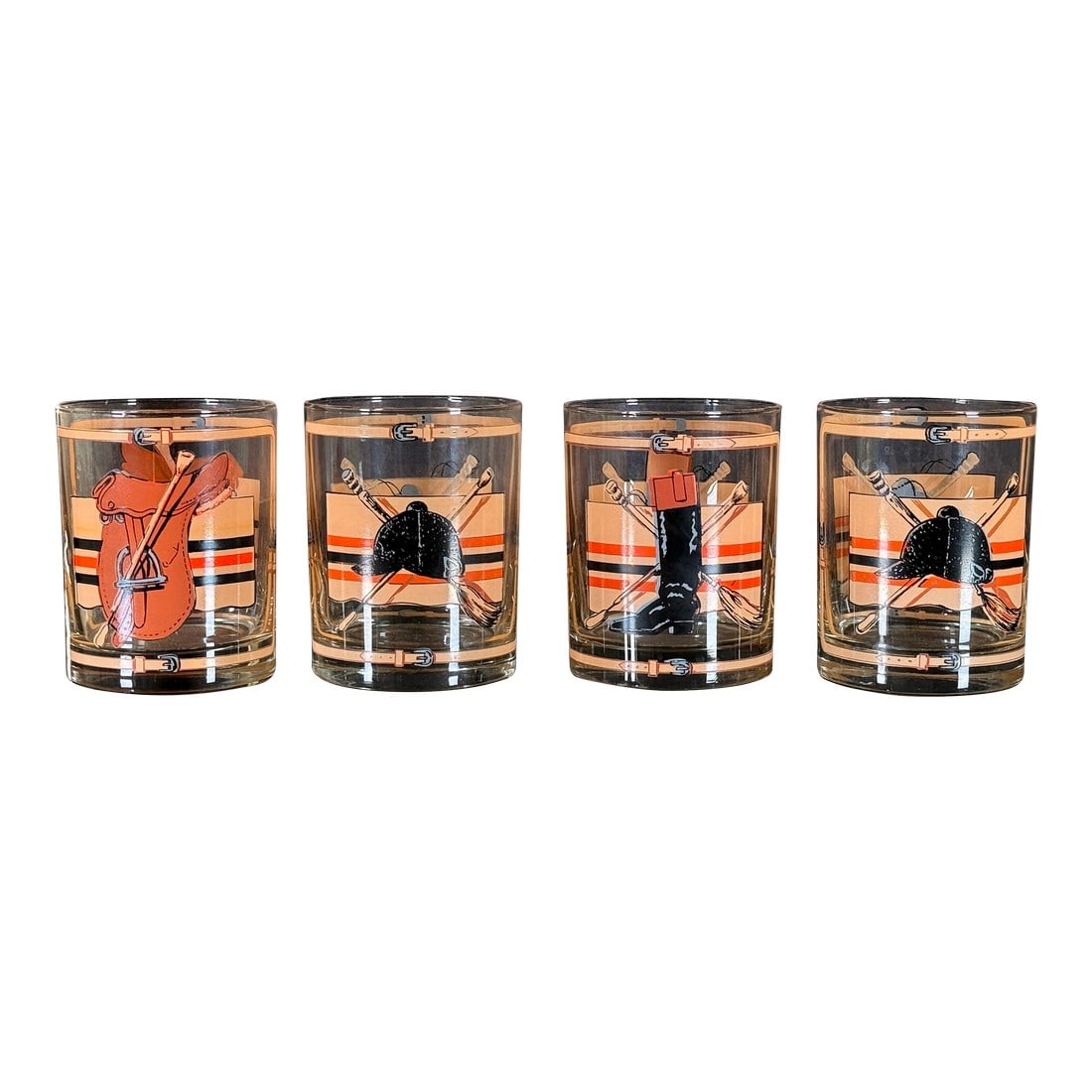 Mid Century Equestrian Polo Theme Rocks Glasses c.1960s - Set of 4: This set of four rocks glasses features a lively equestrian theme with each glass depicting a different piece of polo or hunt equipment, including a saddle, riding helmet, riding boot, and crossed