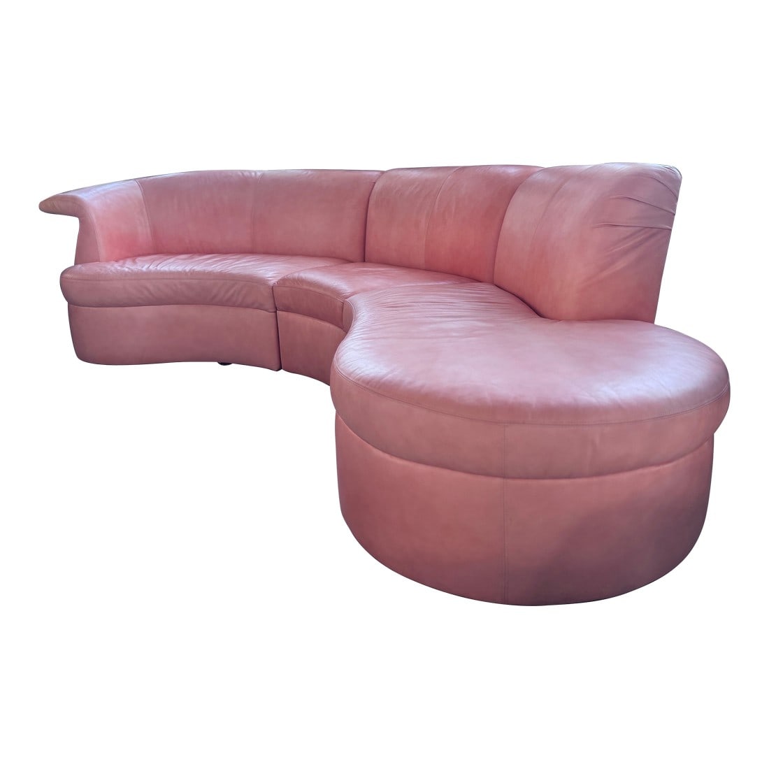 Post Modern Three Piece Peach Sectional by 'Carson's': Vintage curved sectional sofa from 'Carson's', upholstered in original peach-toned Naugahyde. This sculptural three-piece design features soft, rounded lines and a silhouette in the style of the late