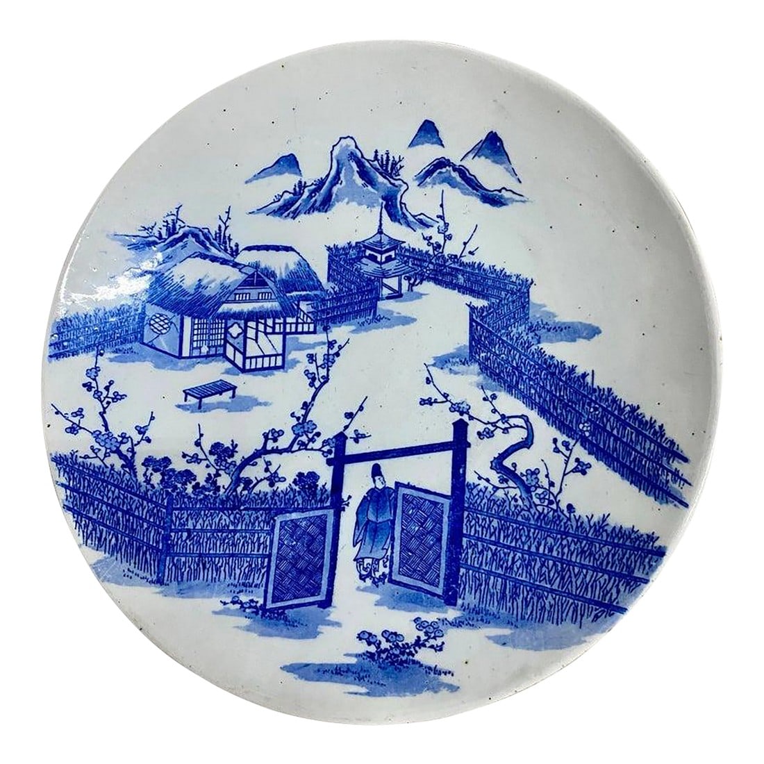 Antique Japanese Blue and White Porcelain Charger Plate With Pictorial Spring Scene: Japanese hand painted Blue and White porcelain charger Plate with pictorial spring country scene. The painting features a landscape scene with mountains in the background. There is a man, in