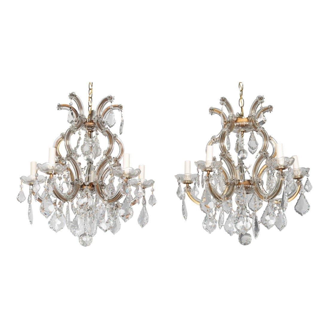 Mid 20th Century Maria Theresa Crystal Chandelier Pair: A set of two vintage Maria Theresa style five-light crystal chandeliers. Each with curving, ornate gilt metal frame clad in glass plates and adorned with rosettes, crystal pendalogue prisms and facete