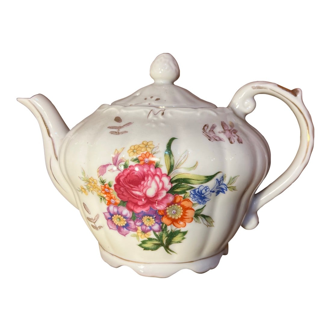 1950 Floral Porcelain Musical Teapot Music Stands: 1950s, Mid 20th Century porcelain tea pot with hand-painted floral motifs and gold gilded accents. A wind-up music box mechanism is built into the base, which plays the tune "Tea for Two" when the