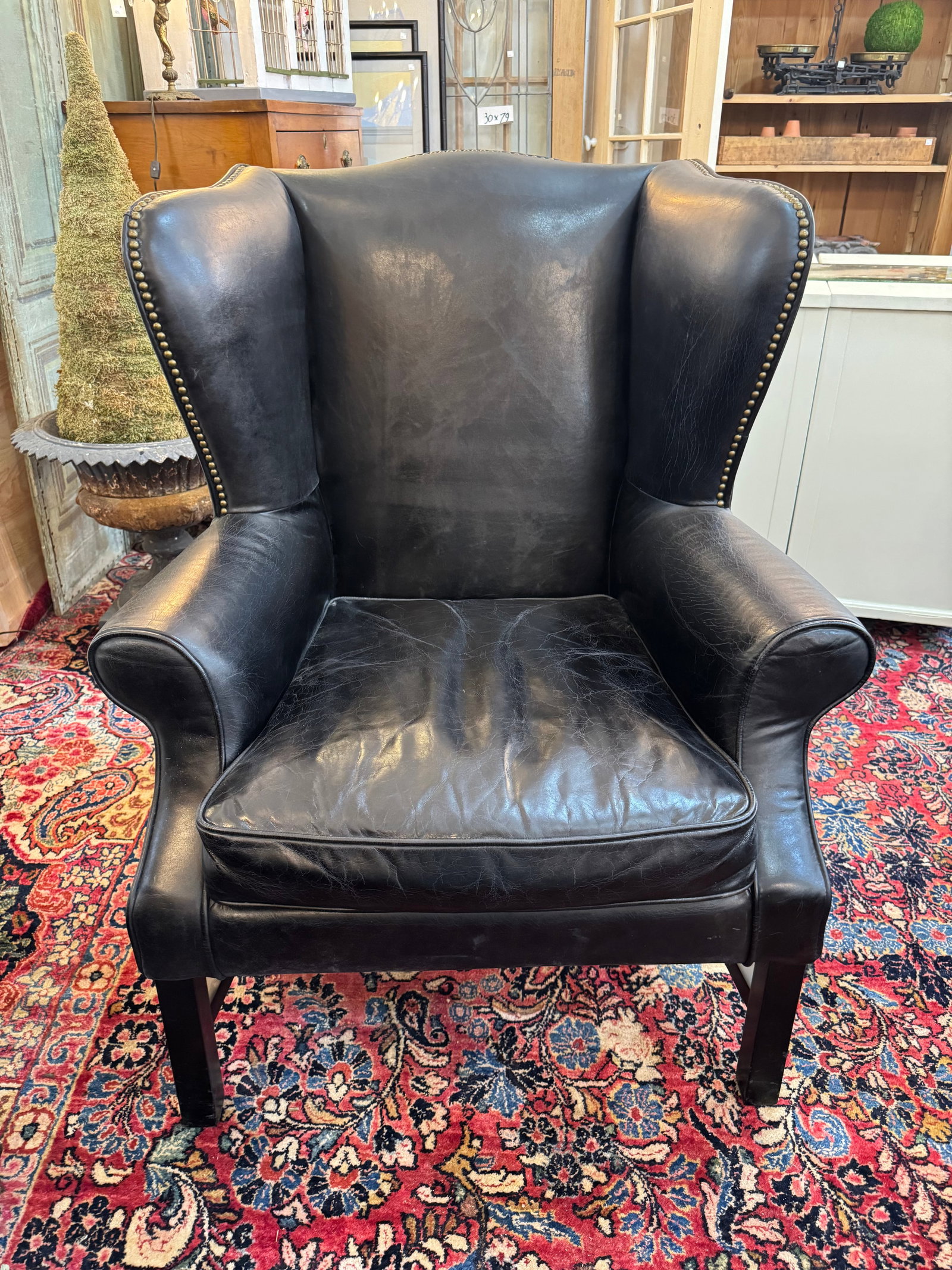 Pair of Vintage Black Leather Wingback Chairs With Brass Nailhead Trim - 3
