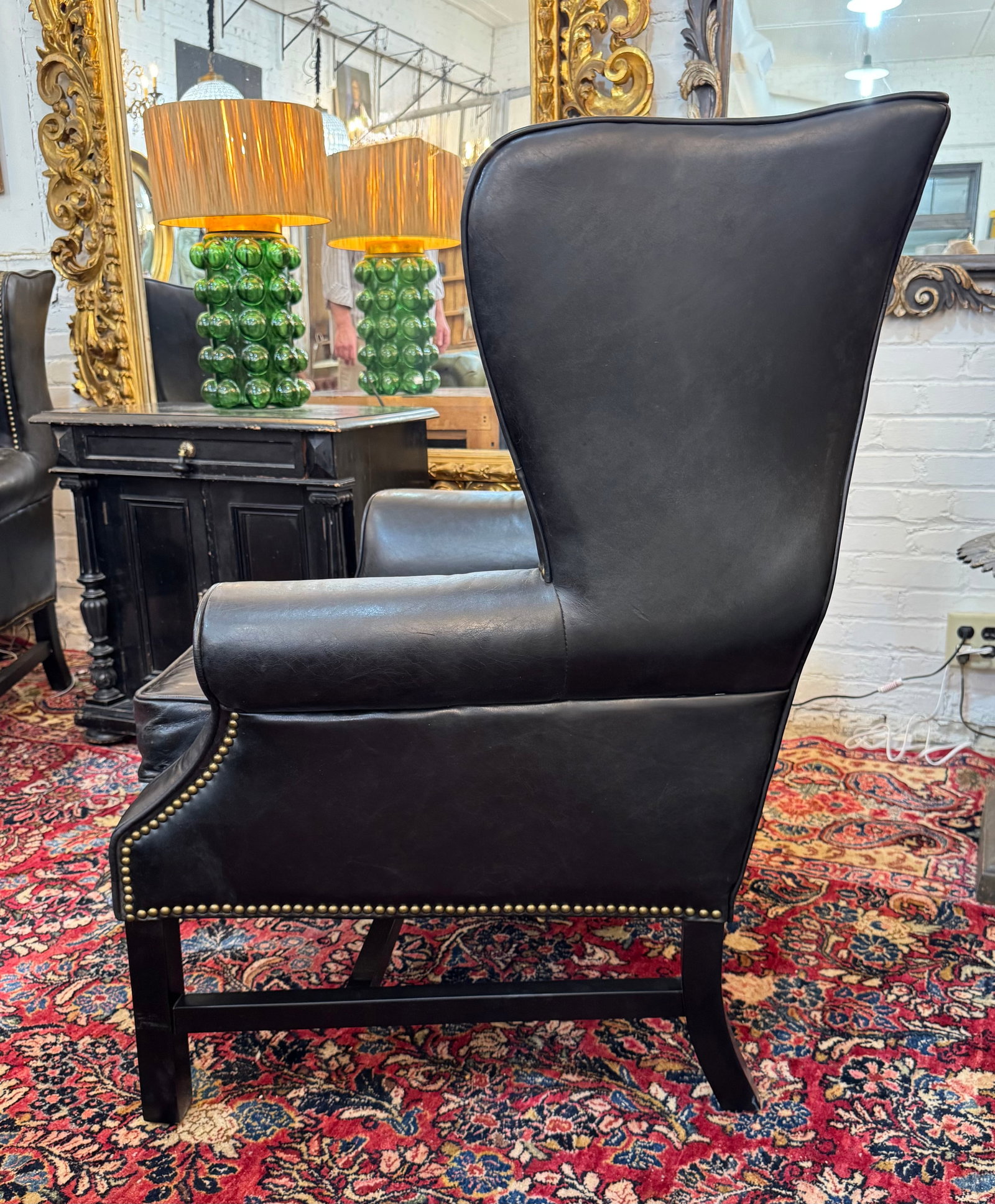 Pair of Vintage Black Leather Wingback Chairs With Brass Nailhead Trim - 4
