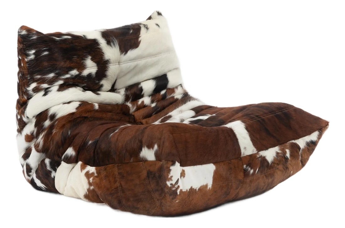 Vintage Ligne Roset Togo Fireside Chair in Natural Cowhide - Michel Ducaroy, 1970s: Designed by Michel Ducaroy for Ligne Roset in 1973, the Togo remains one of the most recognizable seating designs of the 20th century. Its distinctive low profile, deeply pleated construction, and