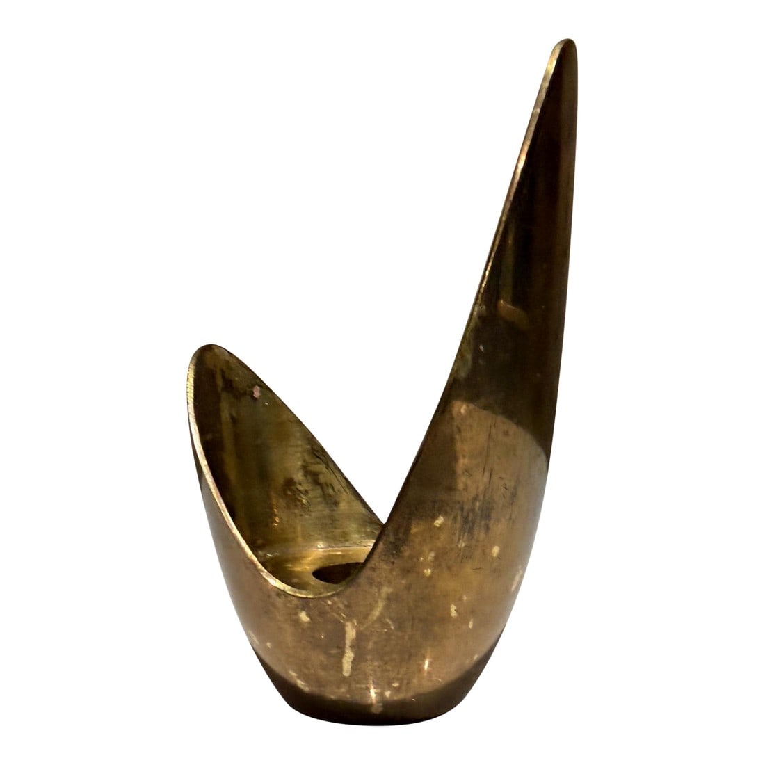 An Abstract Mid-Century Modern Candle Holder Schiaparelli Style: For your consideration, an abstract mid-century modern candle holder. Its organic, flame-like design is characteristic of vintage brassware from the 1950s and 60s, often attributed to the