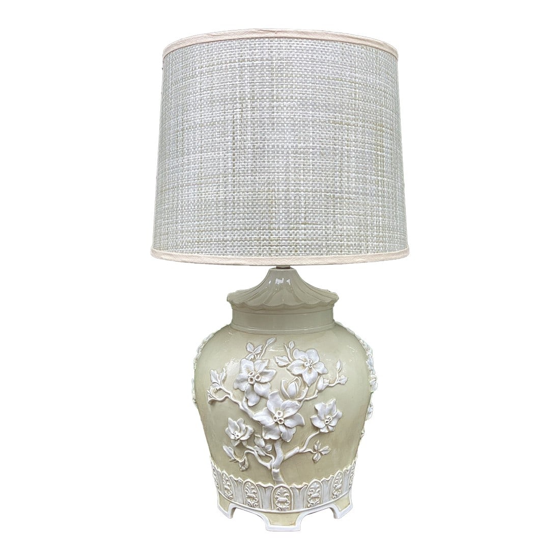 1970s Chinoiserie Relief Porcelain Celadon-Cream Table Lamp With Floral Motif & Textured Shade: A beautifully sculptural chinoiserie-style porcelain table lamp featuring an elegant raised floral relief in a soft celadon-cream glaze. The body is richly detailed with blossoming branches in high re