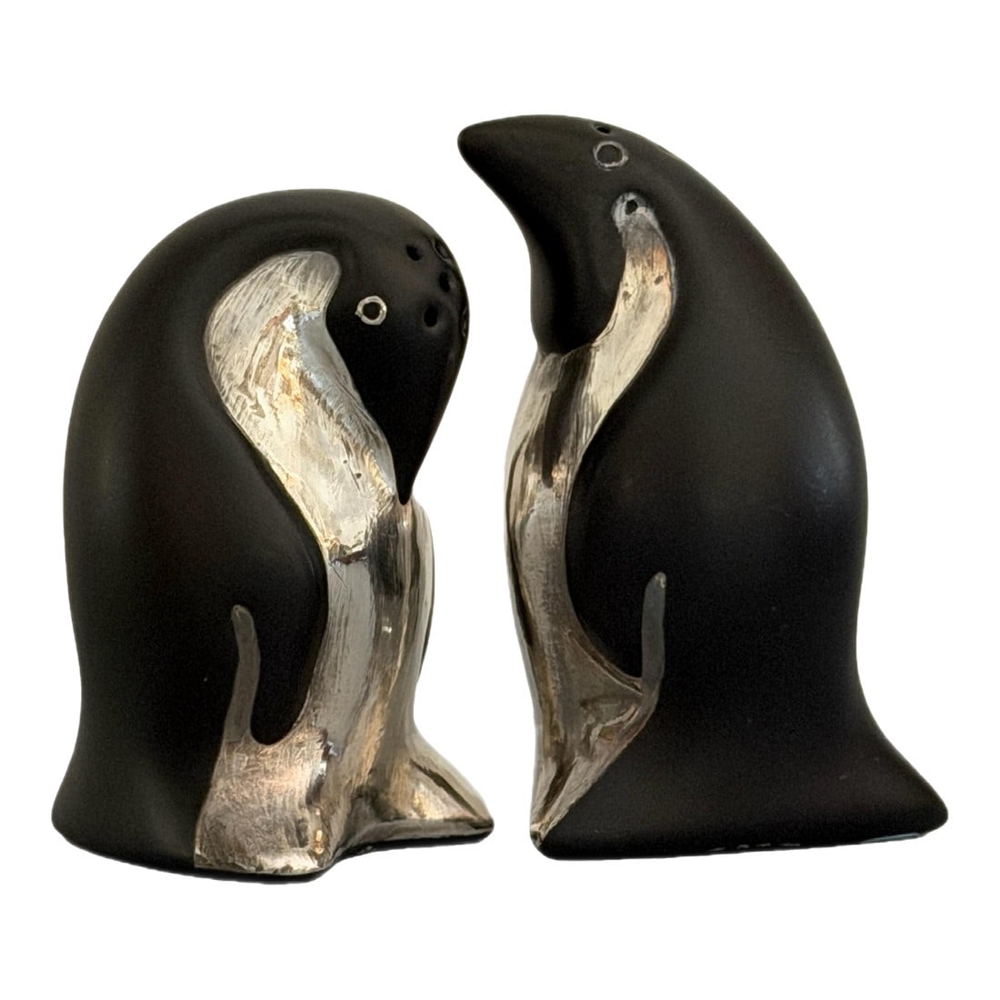 1980s Emilia Castillo Taxco Sterling and Porcelain Penguin Salt & Pepper Shakers - a Pair: These stunning penguin salt and pepper shakers are a signature example of Emilia Castillo's celebrated "Silver on Copper" technique combining matte black porcelain with intricate silver overlay.