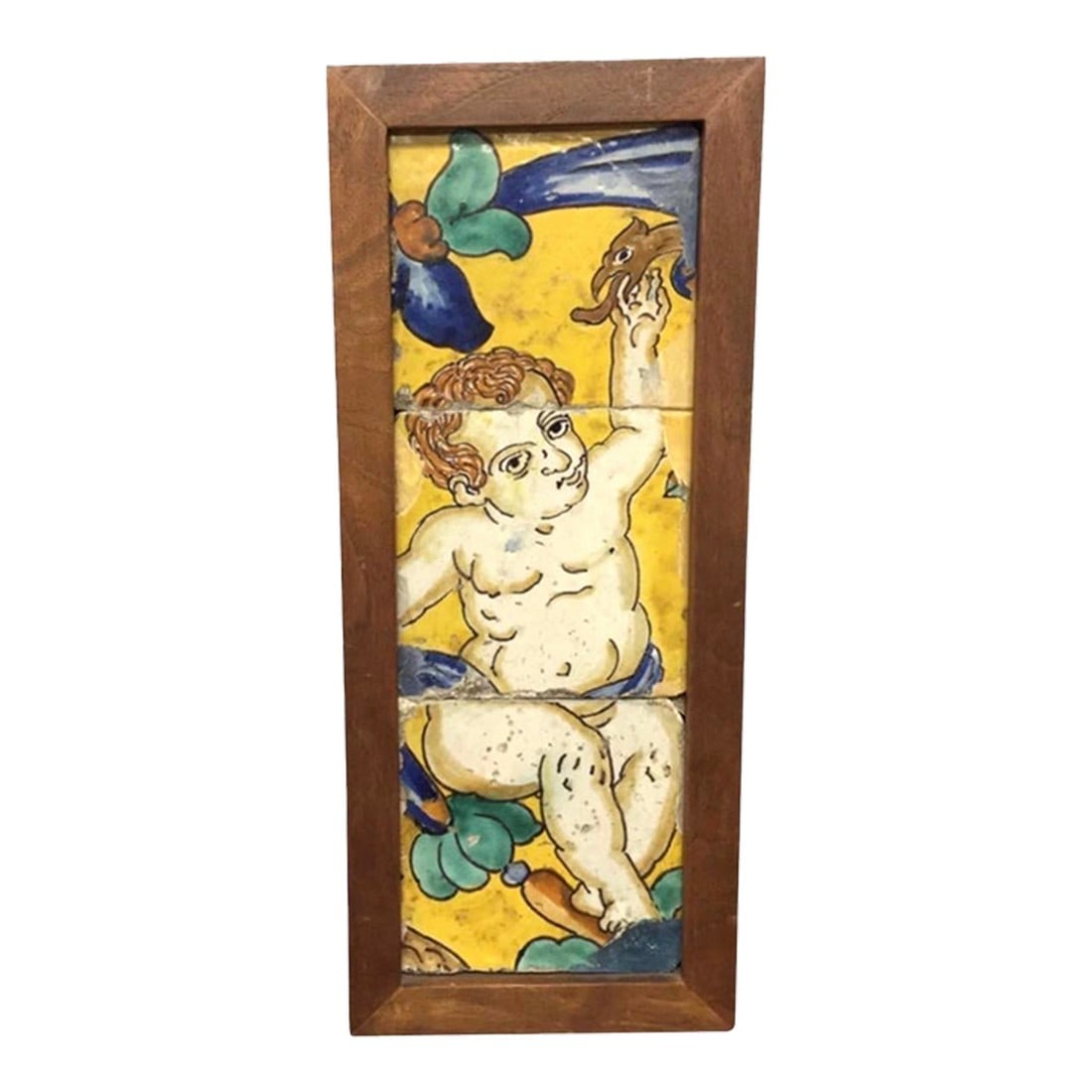 18th Century Italian Majolica Faience Pottery Putto Framed Tiles: Decorative 18th century Italian Maiolica Faience Tile Panel, vividly painted and beautifully presented within a custom frame. Composed of hand-painted tiles, the scene depicts a playful putto (cherub)