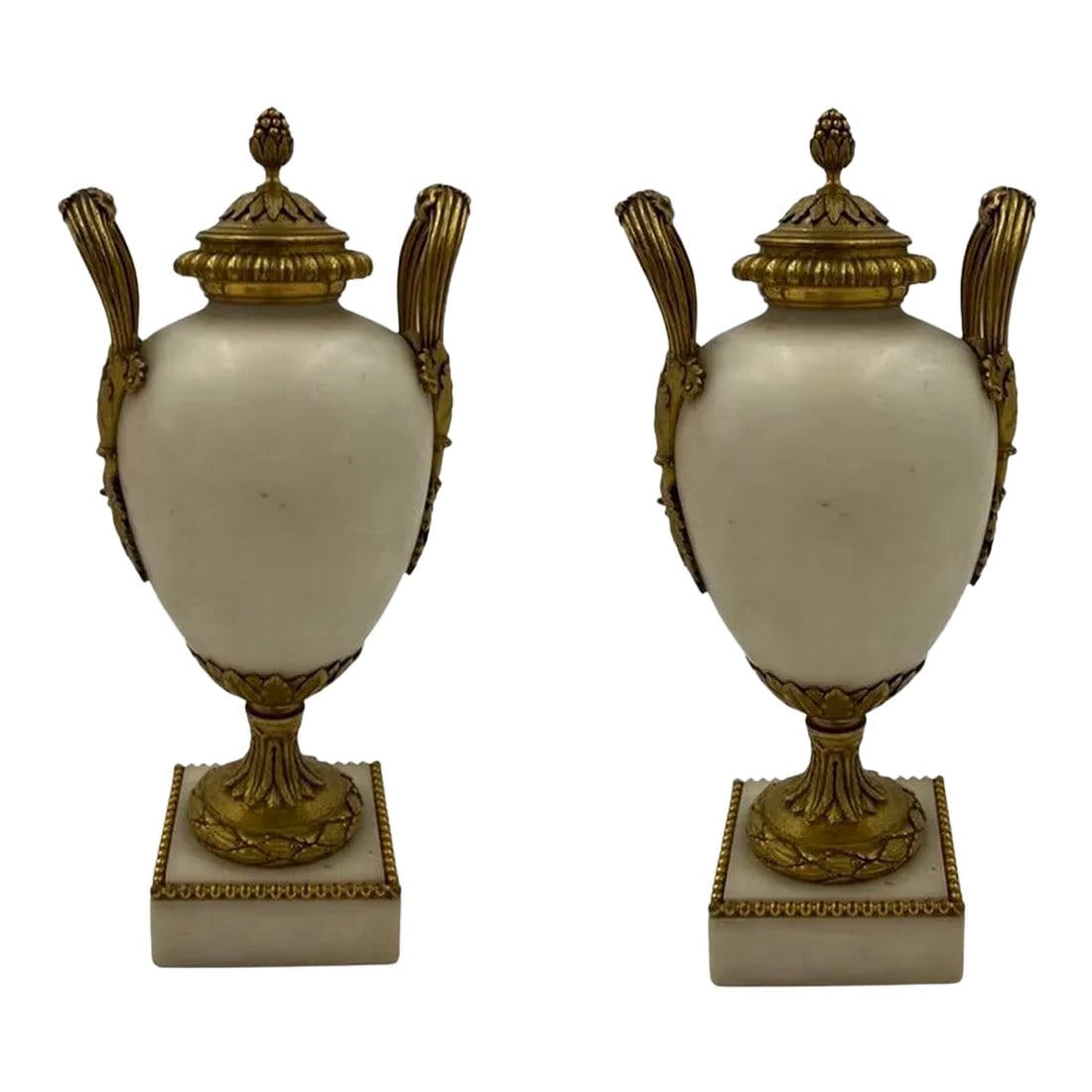 Fine Quality Pair, 19th Century French White Marble Bronze Ormolu Mounted Vases: A phenomenal pair of 19th century french white marble vases with quality gilt bronze ormolu mounts including a beaded rim to base, acanthus leaf supports, artfully crafted foliate and vine form handle