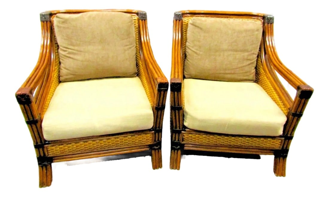 1970s Rattan Wicker Mandalay Chairs With Cushions - Set of 2: This product is a matching pair of rattan wicker Mandalay chairs with cushions, ideal for indoor use. The chairs are fully assembled and come in a light wood tone with cushions. They are accent