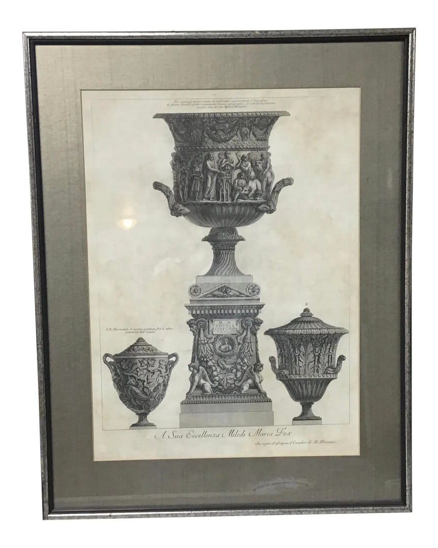 Three Marble Vases and a Sarcophagus. Etching by g.b. Piranesi,: The central vase is carved with a priest and worshippers sacrificing the suovetaurilia (a boar, a ram and a bull), and is placed on a sarcophagus guarded by winged sphinxes. The left vase is carved wi