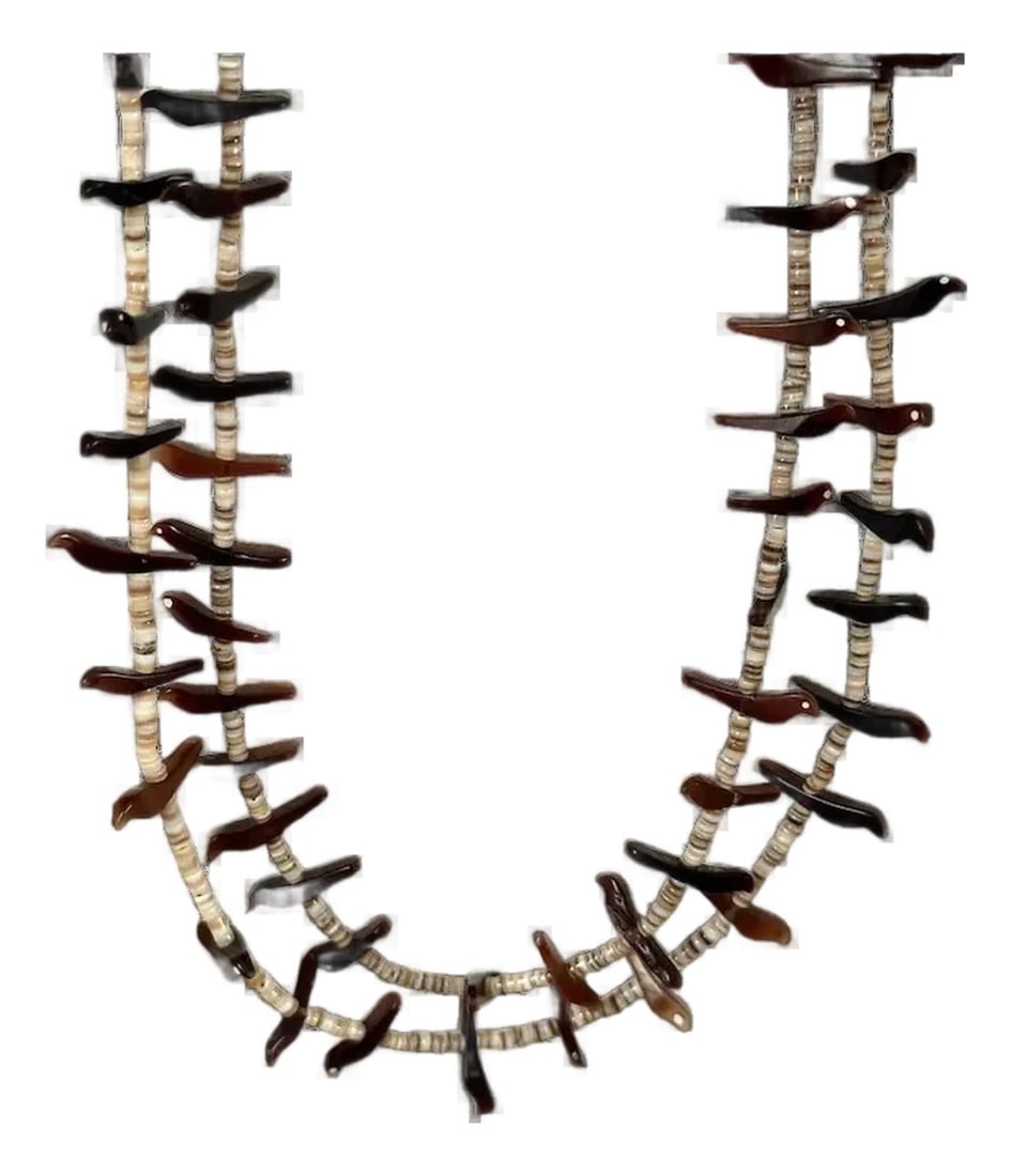 Vintage Native American Zuni Fetish Necklace: Double strand Zuni fetish necklace with heishi beads and birds. Some of the birds have inlaid white eyes. Wonderful piece that measures 13" and 14" respectively. Secure screw clasp. Thank you for