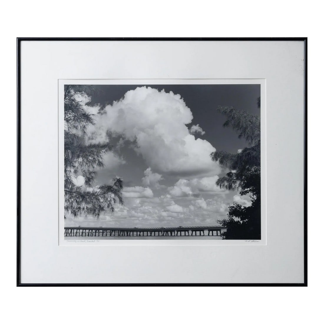 William L. Thomas Sanibel Island Silver Gelatin Photograph: William L. Thomas Causeway & Cloud, 1995 silver gelatin titled and signed sight: 20 by 16 inches frame: 28 by 24 inches William L. Thomas began his photographic career after studying under Ansel Adams