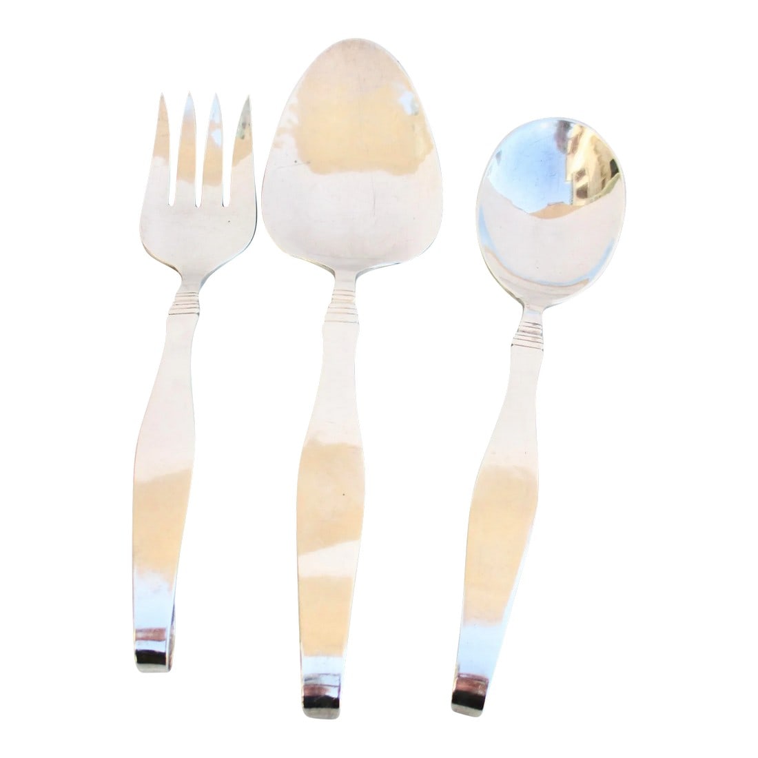 Sterling Silver Serving Set by Karl Leinonen Circa 1940s-A Set of 3: Karl L. Leinonen working in Boston. A hand-made silver set in deep three-dimensional details. Finnish design set featuring a serving fork, serving spoon, and a large server. The design features long f