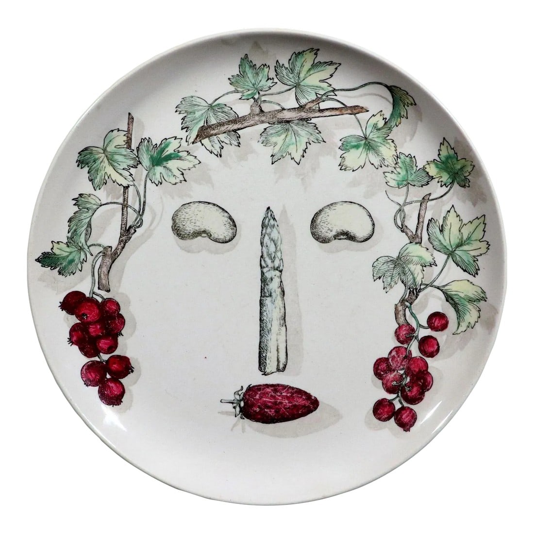Piero Fornasetti Pottery Arcimboldesca Vegetable Face Plate, After Giuseppe Arcimboldo: Piero Fornasetti Pottery Arcimboldesca Vegetable Face Plate, After Giuseppe Arcimboldo, Number 12, Circa 1960's-70s The pottery plates are after Giuseppe Arcimboldo-the design of a face creatively des