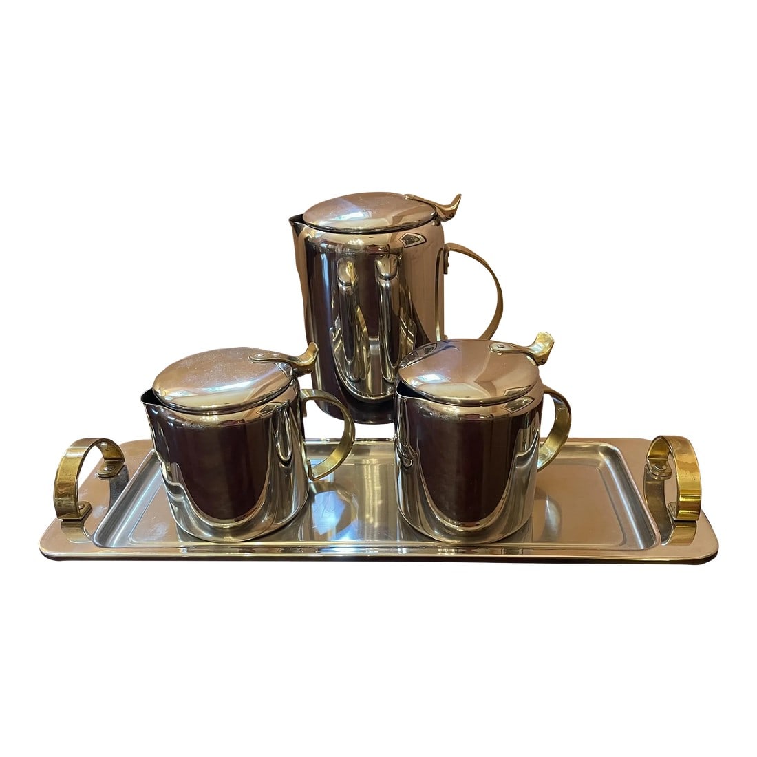 1960s Mid-Century Modern Polished Chrome and Brass Tea or Coffee Service With Tray- 4 Pieces: A fabulous MCM find! I love the clean modern timeless lines, as well as the simplicity of the combined brass and polished chrome materials. Though there is no direct attribution mark, I'd say these ar