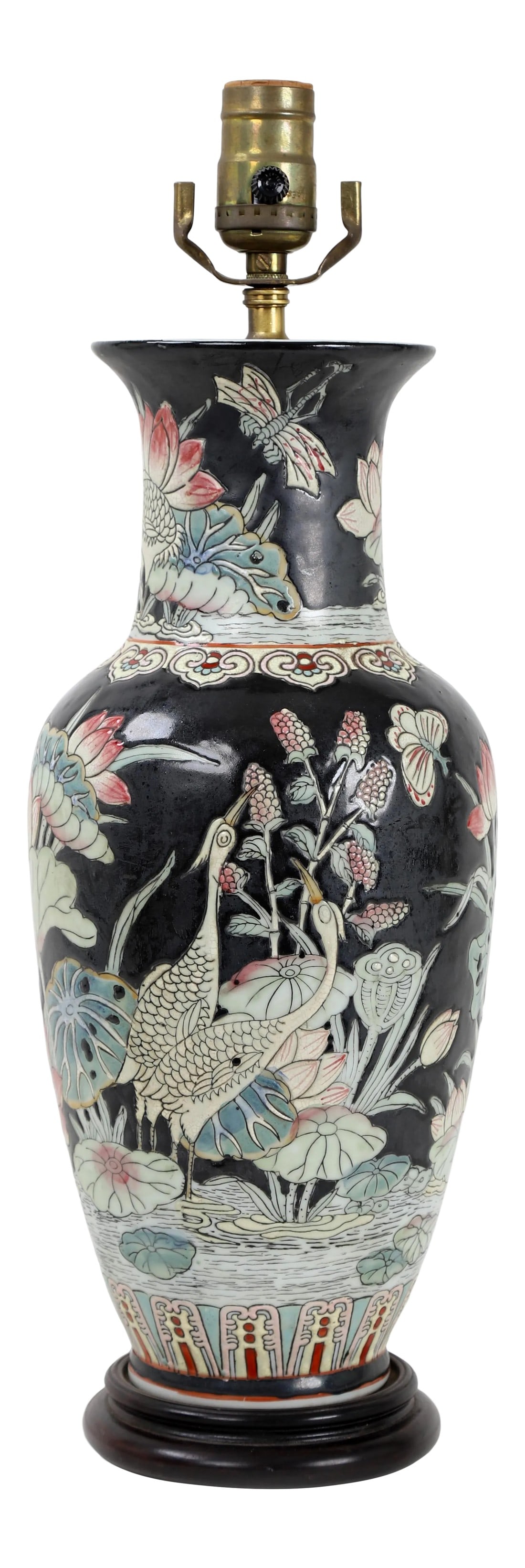 1970s Famille Rose Vase Lamp Featuring Cranes With Foliage & Fauna: This famille rose vase lamp features a pair of cranes frolicking in a pond with foliage bearing fruits and other fauna like a dragonfly. Symbols of happiness and prosperity line the bottom of the