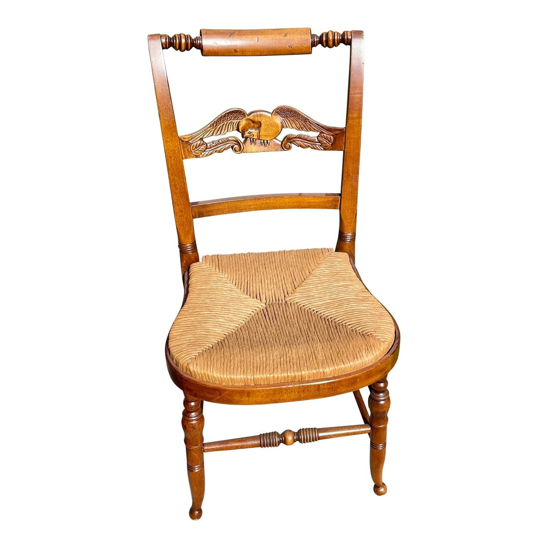 Hitchcock Style Carved Eagle Back Balloon Chair: Offered is a maple balloon chair. It is in the Hitchcock style with a carved eagle back and a pillow top. The rush seat is in excellent condition as is the rest of the chair. It would make an excellen
