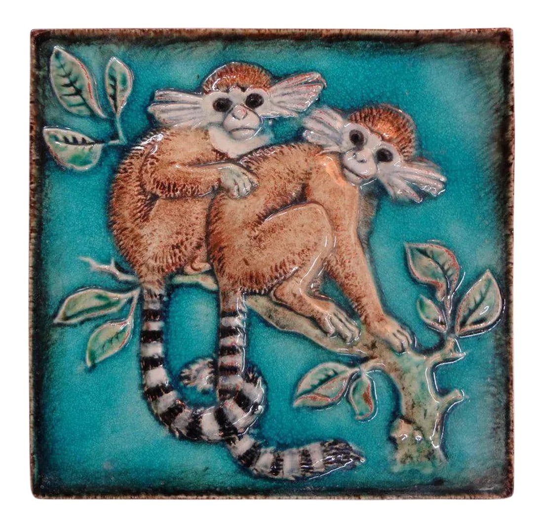 1920's Vintage Karlshrue Monkey Glazed Terracotta Tile: Stunning German glazed terra cotta or Majolica monkey sculpture by Karlshrue, circa 1920. This gorgeous tile or wall art depicts two monkeys on a tree branch. Well detailed and beautiful crisp colors.