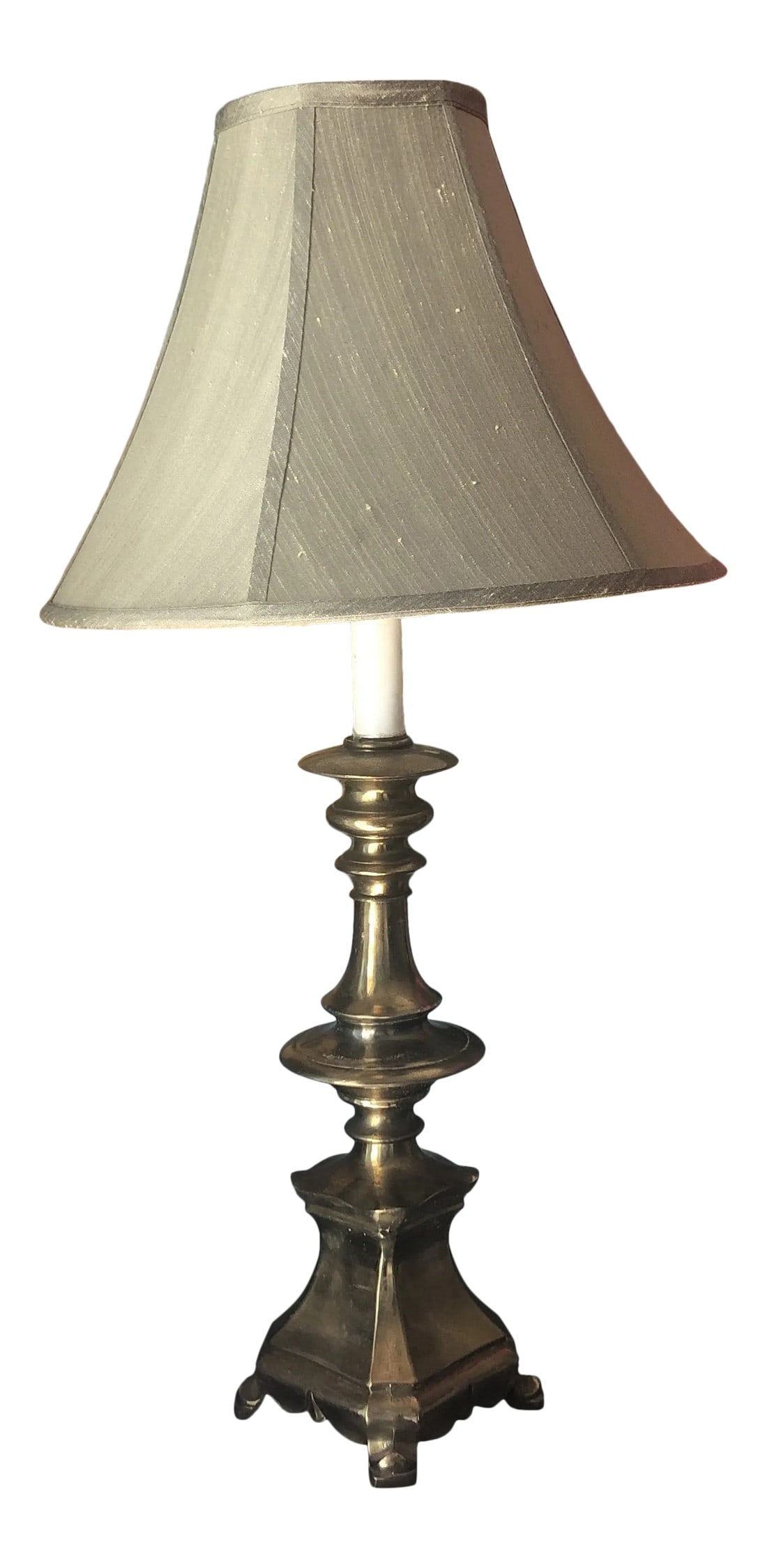 1970s Brass Footed Table Lamp With Shade: Cozy up to this solid brass lamp with pagoda features and footed Details. In good working Vintage Condition. Lampshade included. Perfect for the interior designer. Condition: Alterations: Original