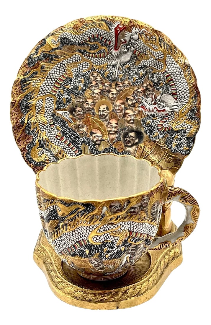 Extraordinary Meiji Satsuma Cup & Saucer, Raised Gilt Enamel Signature, Kozan Zo - a Pair: Extraordinary Meiji Satsuma Cup & Saucer, Raised Gilt Enamel Signature, Kozan Zo, Japan, circa 1900s This extraordinary Meiji-era Satsuma cabinet cup and saucer set, crafted by the renowned Kozan