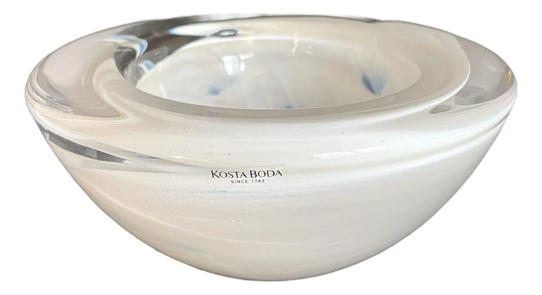 Swedish Kosta Boda "Atoll" Art Glass Bowl Designed by Anna Ehrner: Here is a stunning art glass bowl designed by Anna Ehrner and made by Kosta Boda in the later 20th c. The piece features a white ribbon/swirl design that is encased in 2" thick transparent glass. It