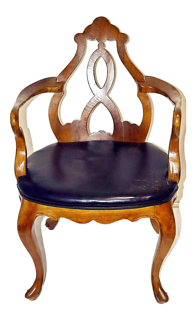 1920s Art Nouveau Italian Armchair: Unique armchair or desk chair from Italy, with black leather seat, art nouveau influence with all cabriole legs, serpentine apron, demilune shaped back. Amber tone color on hardwood birch. Sturdy and