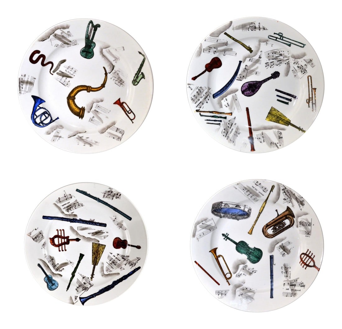 Early 1950s Piero Fornasetti Musical Pottery Plates - Set of 4: Early Piero Fornasetti Set of Four Musical Pottery Plates, Circa 1953 (Ref: NY9279/apr) The set of plates depict six different designs of different musical instruments spread across the surface with s