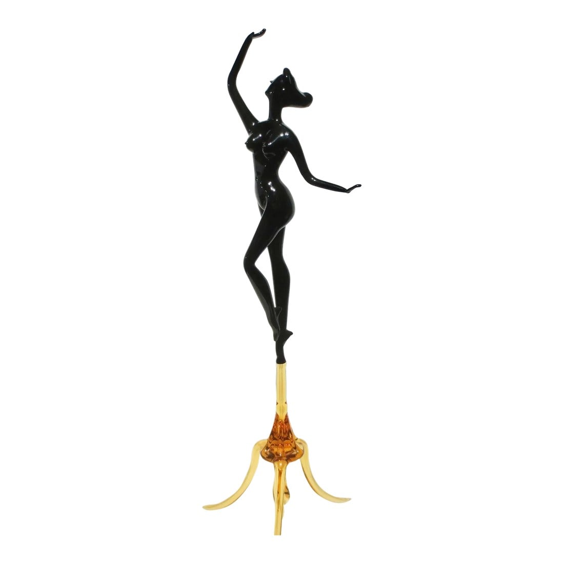 Murano Glass Female Nude Dancer: Fine Studio glass figure, Murano pipework dancer of a female nude, poised on top of a tripod base. Black body and amber color tripod, balanced by a large finial under the legs. Long thin finely
