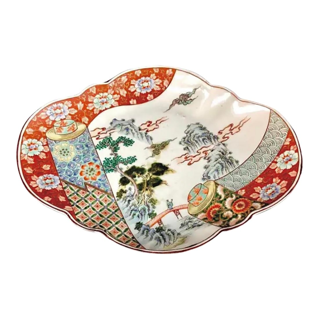 Large Japanese Imari Porcelain Platter: 19th Century Japanese Imari Porcelain Platter. Platter is 15" in length and has a landscape and floral pattern. Plate has vibrant colors of blue, red, green, and yellow against a white background.