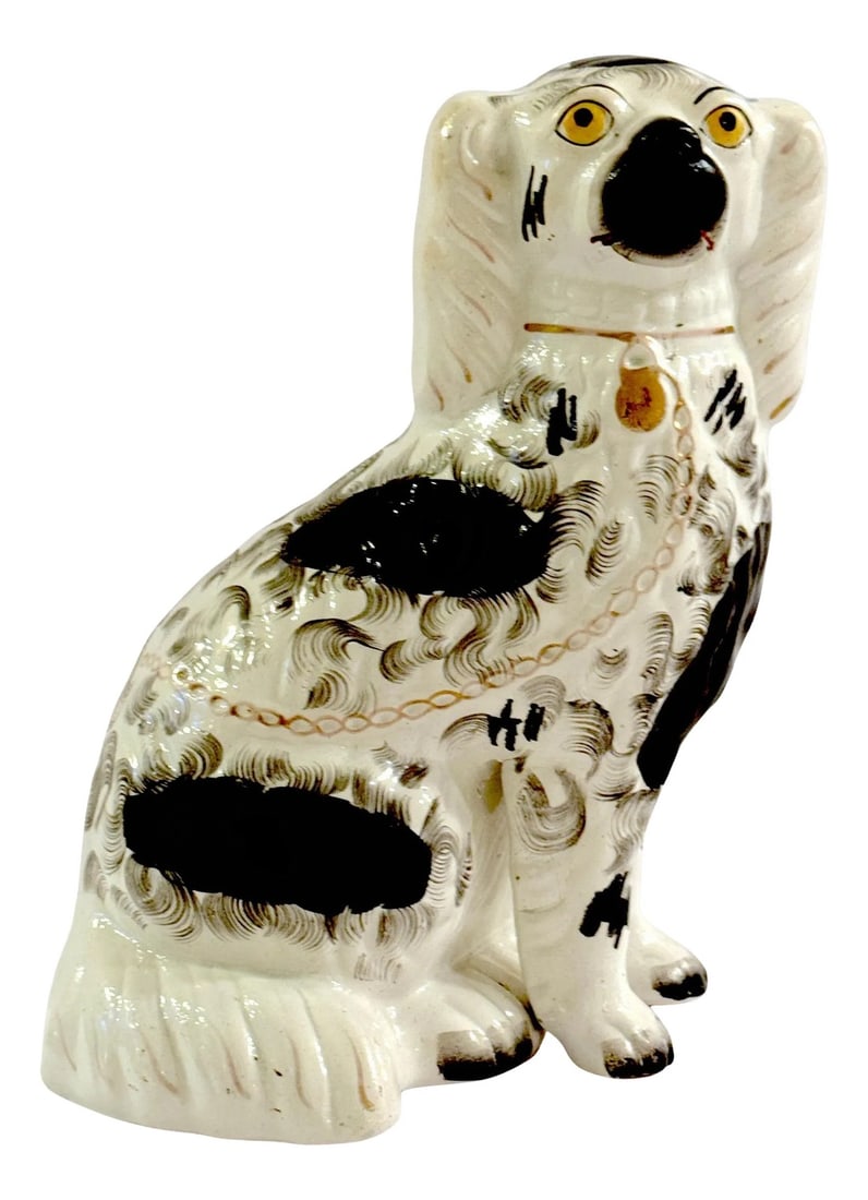 19th Century Staffordshire Unique Black & White Spaniel with Separated Foot: 19th Century Staffordshire Unique Black & White Spaniel with Separated Foot England, Circa 1860s This distinctive 19th-century Staffordshire black-and-white spaniel figure, made in England circa the