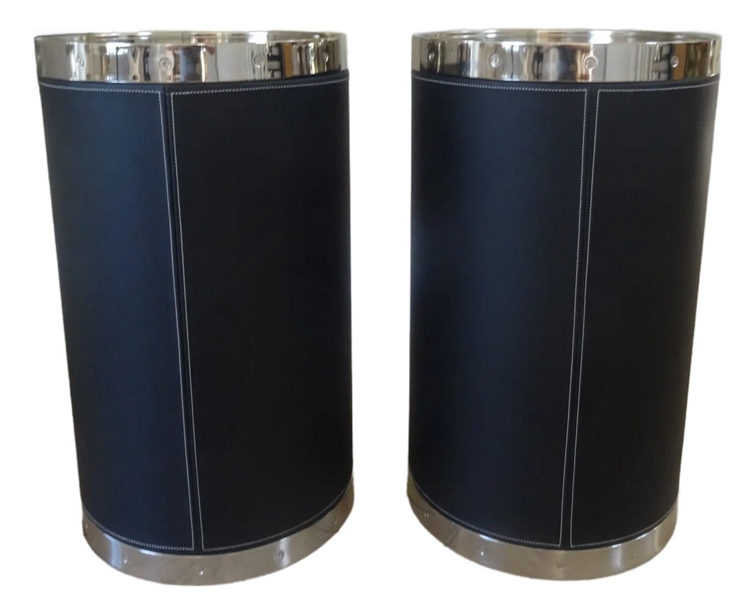 Pair of Patrick Black Leather Cylinder Drink Tables by Port 68: A Chic pair of Versatile Drink Tables by high end Furniture manufacturer Port 68 in a polished nickel steel metal top and base. Featuring textured black leather with a contrast top stitching detail. L