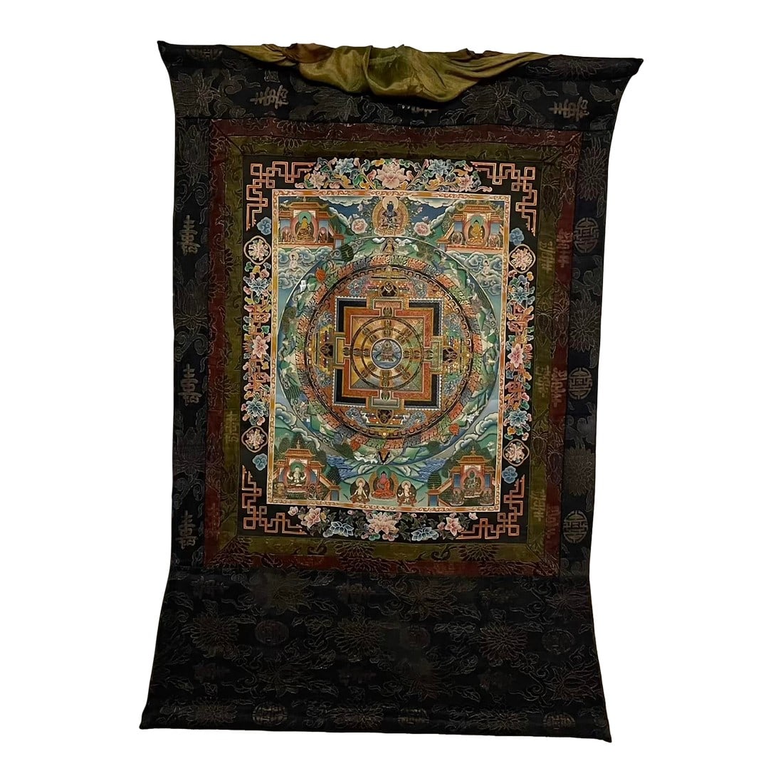 Hand-Painted Tibetan Mandala Thangka With Silk Brocade Mounting: A radiant example of traditional Himalayan spiritual art, this hand-painted thangka features a detailed mandala surrounded by vivid depictions of Buddhas, bodhisattvas, and guardian figures. Rendered 