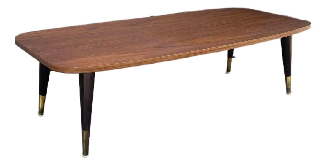 1960s Mid-Century Modern Coffee Table With Tapered Legs & Brass Accents: Elevate your living space with this stylish Mid-Century Modern coffee table, a perfect embodiment of sophisticated 1950s-1960s design. This table features a beautifully finished rectangular top with s