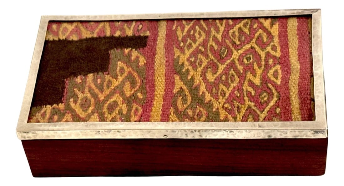 Pre-Columbian Andean Textile Fragment in Sterling Silver & Hardwood Presentation: Pre-Columbian Andean Textile Fragment in Sterling Silver & Hardwood Presentation Box Textile: Wari or Inca Culture, Andes, Circa 600–1400 CE Box: Mid-20th Century A refined and historically rich