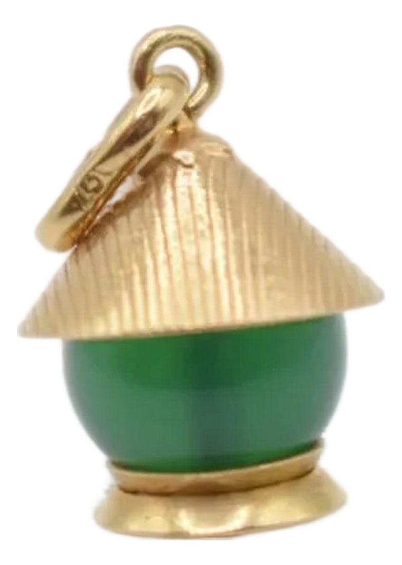 Mid 20th Century Green Lantern Charm: This is an adorable charm that could go on a necklace or bracelet! It is a 18kt gold mid century gold charm with a green gemstone. We are not certain what type of green gemstone it is. Condition: