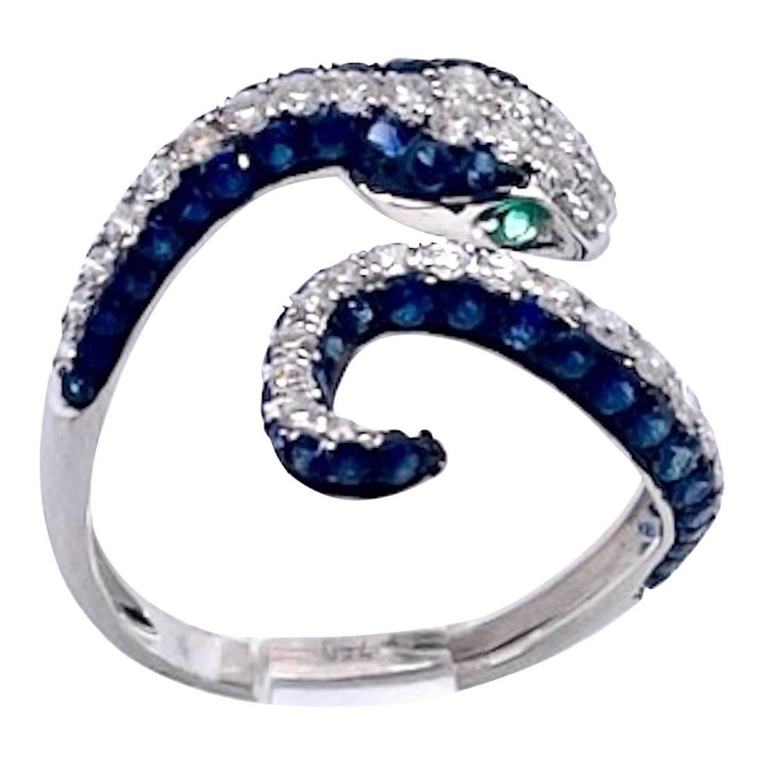 1990s Sapphire Diamond Snake Ring 18k, Size 6.5: This beautiful snake ring comes out of Barcelona Spain and it is stunning. This is a simple and delicate looking ring with a lot of punch. It is made of 18K White Gold with round brilliant Diamonds of
