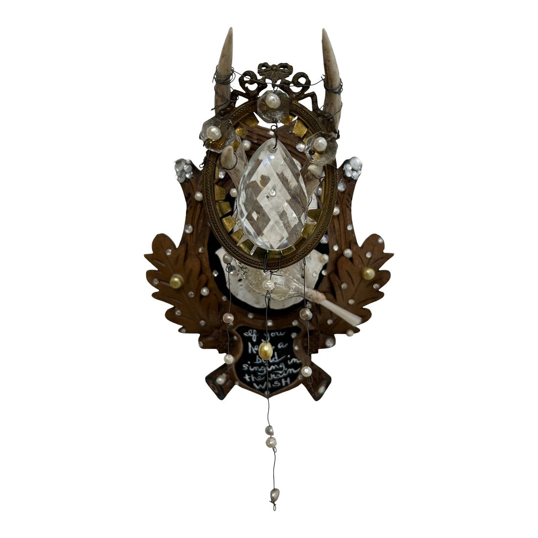 Black Forest Deer Skull Wall Sculpture: Wonderful found object wall sculpture that began as an antique Black Forest deer skull on plaque, transformed into a lovely work of art titled "Wish". A central vintage bird is surrounded by pearl