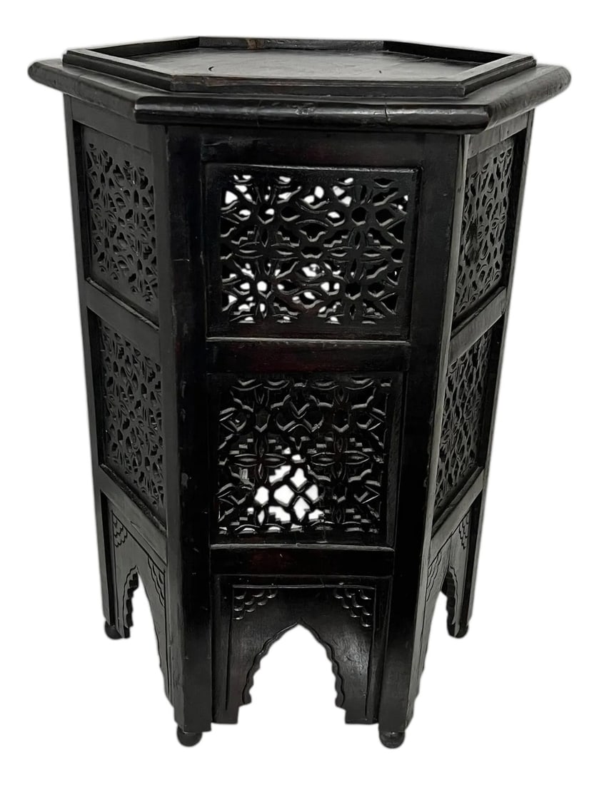 Vintage Anglo Indian Hexagon Hand Carved Drink Table: Vintage Anglo-Indian side drink table. Carved floral pattern beneath a hexagon top with gallery. Measures at the widest 18" x 18" x 23.5" h. Space inside the gallery is 12". Some shrinkage consistent 