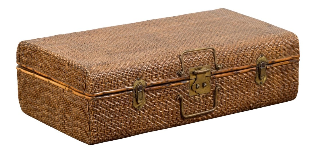 Indian Vintage Bamboo and Woven Rattan Suitcase with Brass Hardware: An Indian vintage bamboo and woven rattan suitcase from the mid 20th century, with brass hardware. Created in India during the midcentury period, this vintage suitcase features a rattan bound
