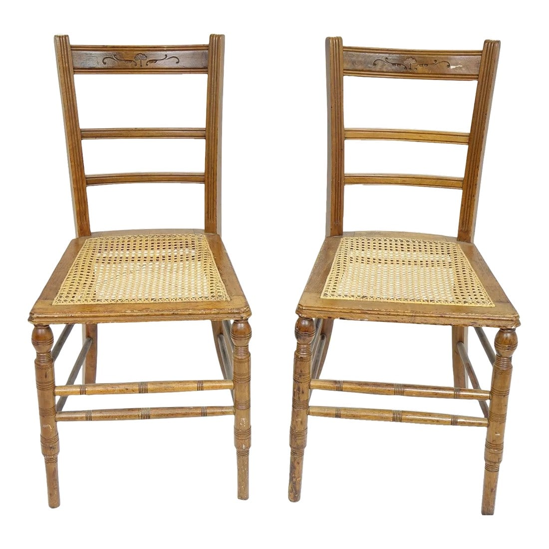 Vintage Chairs With Woodwork - a Pair: This charming pair of vintage chairs showcases exceptional craftsmanship and timeless design. The elegantly tapered legs and intricately turned spindles highlight the skilled woodwork, while the natur