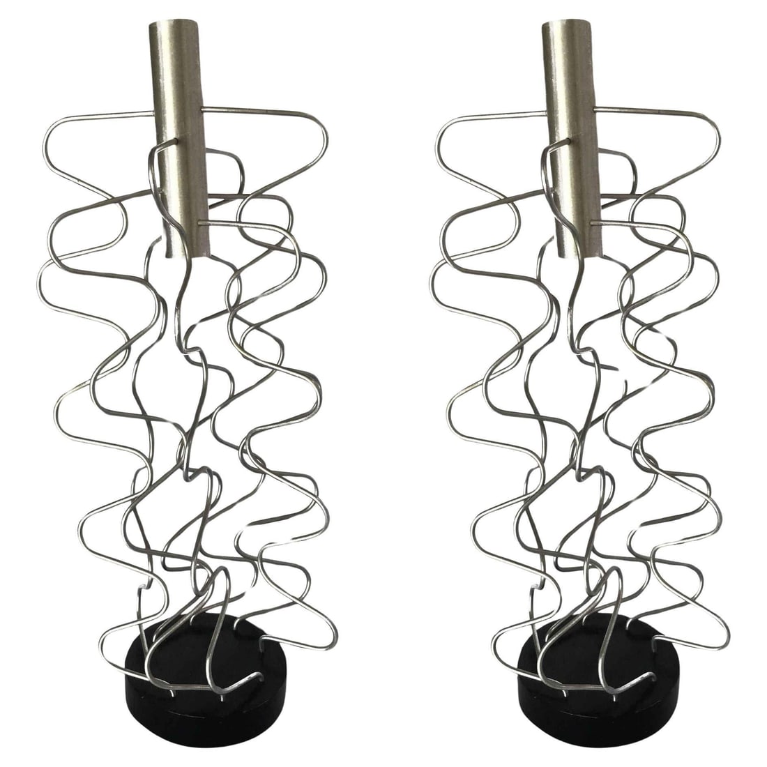 Custom Made Wire Art Candlestick Holder, Pair: Title: Custom Made Wire Art Candlestick Holder, Pair Description: Pair of custom Made Wire Art candlestick holders made of 8 sculptural wire pieces fixed to a black base with chrome holder along the t