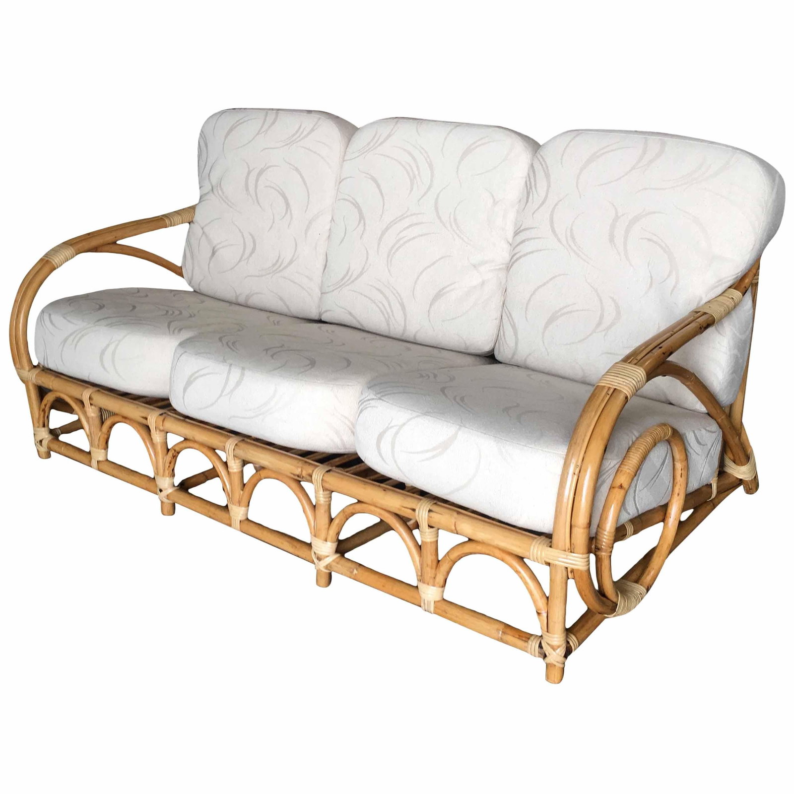 Restored Two-Strand "Circles and Speed" Three Seat Rattan Sofa: Title: Restored Two-Strand "Circles and Speed" Three Seat Rattan Sofa Description: This rattan sofa has what we at the shop call the "Circles and Speed" two-strand chair arm with an arched base and st