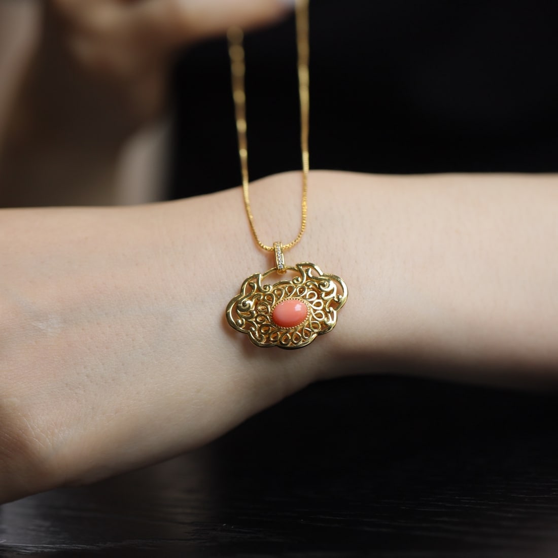 S925 Silver Natural Red Coral Pendant: This pendant features natural red coral set in S925 silver, with a gilded hollow lock design highlighting the vibrant coral. Exquisite craftsmanship makes it perfect for pairing with traditional dress