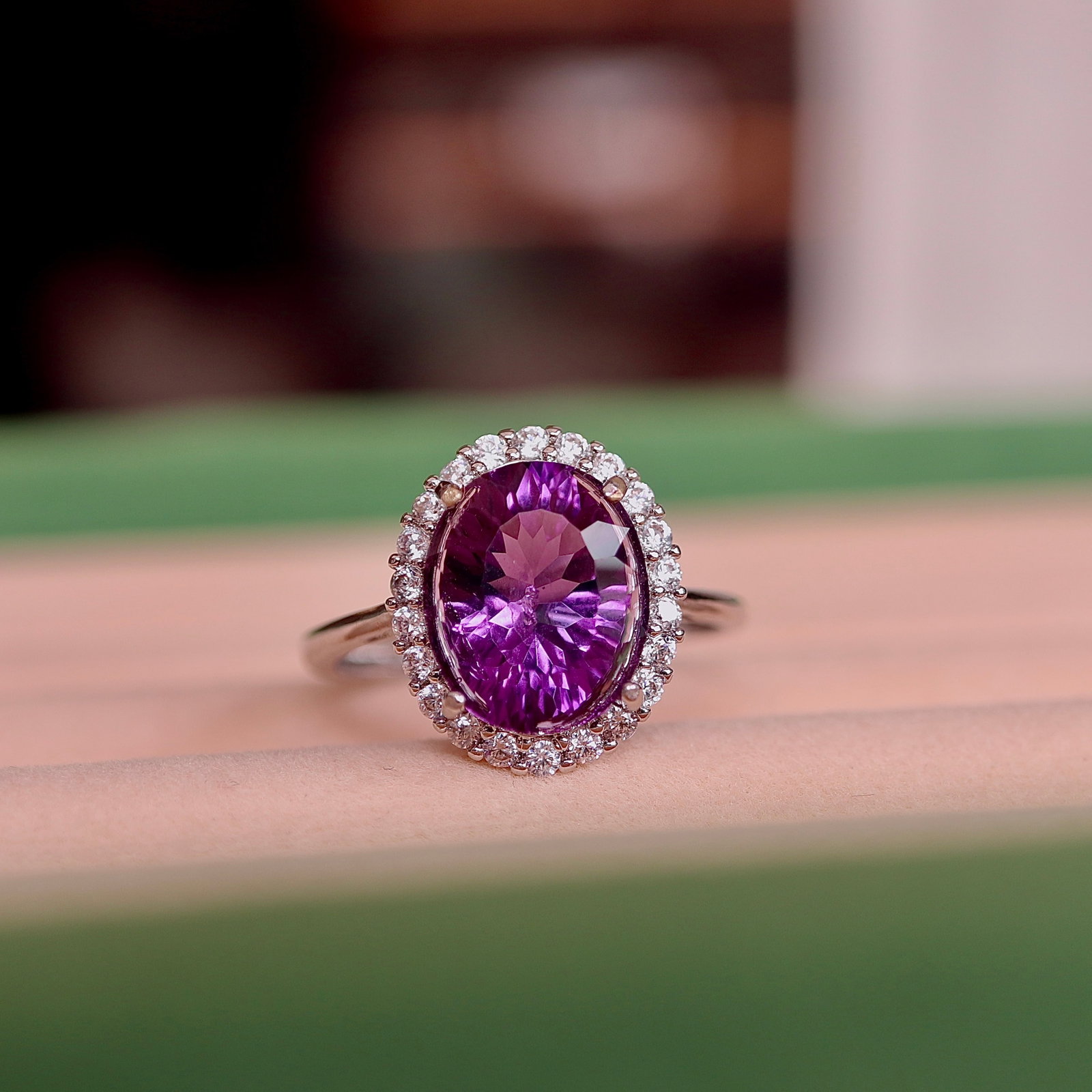 Natural Amethyst Ring: This natural Uruguayan amethyst ring is renowned for its large size and exquisite setting. The fireworks cut enhances the gem's brilliance, exuding a luxurious cool white sheen. Specifications: Size a